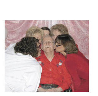 Ed Langdon is surrounded by Bonney Lake Senior Center staff members Lara Wheeler