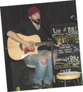 Musician Travis Barker performs at Beyond the Bridge Cafe’s open mic night.