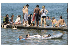 Lake Tapps was bustling with activity July 29 as the heat reached record highs. People swam and rode on motorized watercrafts to escape the heat.