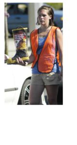 A volunteer helps collect donations for East Pierce Fire and Rescue during the annual “Fill The Boot” campaign for the Muscular Dystrophy Association.