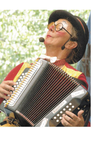 Jest In Time’s Lil’  Zucchini was one of the performers entertaining crowds Friday and  Saturday at the  Enumclaw Street Fair. Local band In and Out and Backwards