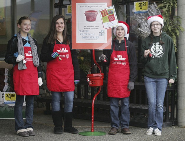 Plateau Outreach Ministries ringers Saturday at QFC Hannah Swettenam