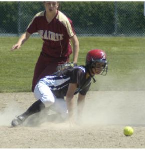 Kim Courneya of Bonney Lake watches the ball as she slides safety into second base during the West Central District tournament last month.