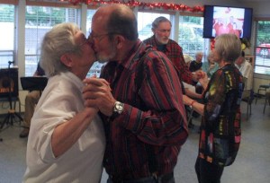 Sandi and Jake Knaus finish their swing dancing at the Senior Center 25th Anniversary with a romantic flourish.