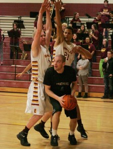 Senior Jacob Zahnow goes up for a layup while double teamed Friday against Enumclaw.