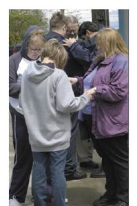Several women pray together during Thursday’s National Day of Prayer in Allan Yorke Park. Mike Keith