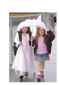 To view or buy photos got to cmg-northwest2.go-vip.net/courierherald Sarah Short and Abigayle Crosslin take cover and Abigayle Crosslin waits for the bus after the last day of school Friday at Dieringer Heights Elementary.  Danielle VanHout hugs her mom