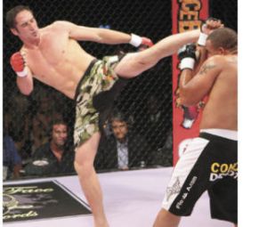 Hometown favorite Cory Devela of Bonney Lake gets in a kick during Saturday’s action at ShoWare Center in Kent.