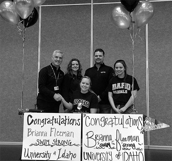 Bonney Lake’s athletic director Brian Scheerer shakes hands with Brianna Fleeman during the lunchtime ceremony Wednesday. Her mom