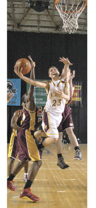 Riley Carel drives the lane during the Hornets’ opener with O’Dea.