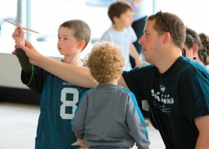 Father and sons fly together at The Museum of Flight.