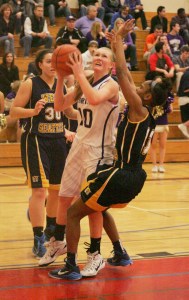 Sumner freshman guard Annie Smith looks for the bucket during Saturday’s regionals game against West Seattle at Renton High School. Despite being injured during the 3A districts title game