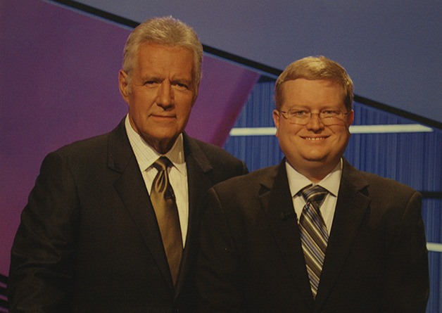 Mike Lewis poses with Jeopardy! host Alex Trebek.