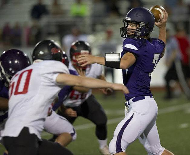 Senior quarterback Chase Torgison looks down field for an open player.