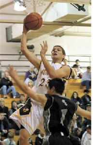 Enumclaw’s Riley Carel takes the ball to the hoop during play with SPSL 3A rival Bonney Lake.