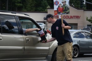 East Pierce volunteers stood on the intersection of South Prairie Road and 200 Ave Ct E. collecting money for MDA.