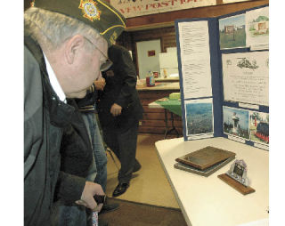 Bruce Bartling takes a closer look at the award Enumclaw’s Veterans of Foreign Wars Post received Thursday night.