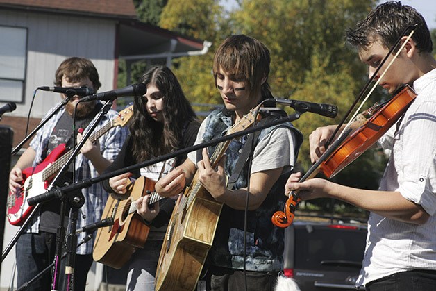 Th Sooner the Better perform at the Enumclaw Music and Arts Festival Saturday