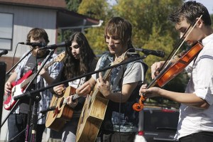 Th Sooner the Better perform at the Enumclaw Music and Arts Festival Saturday