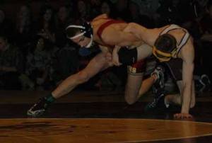 Juniors Tyke Reid of Enumclaw and Bryce Thompson of White River battle in the 120-pound weight division during the annual Hornet-Hornet wrestling match. This year's contest