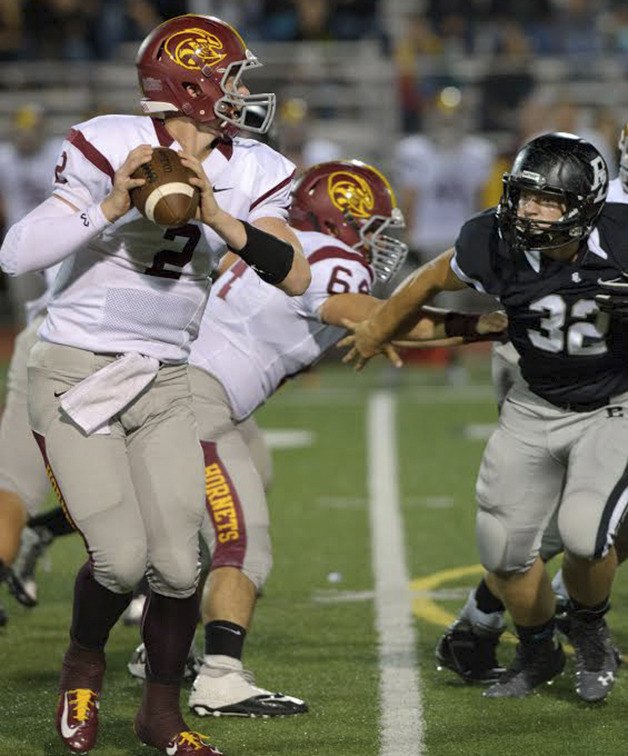 Enumclaw quarterback Scotty Garvin looks down field against Bonney Lake.