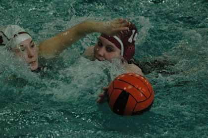 Enumclaw's Alina Van Ruff holds off a Sumner-Bonney Lake player during action April 12. The Hornets won 28-0.