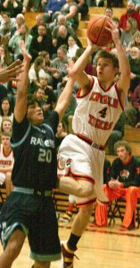 Drew Seabrands gets off a shot for the Hornets despite tough Auburn Riverside defense. The teams met Friday night in Enumclaw
