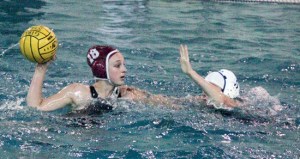 Enumclaw High’s Hayley Sonneson looks for an opening during the Hornets’ Saturday game against Gig Harbor at Rogers High School. Enumclaw will next see action Thursday in the state tournament