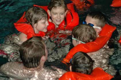 Putting on flotation devices and jumping in are part of the April Pools fun.