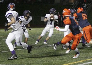 Senior quarterback Chase Torgison looks down field during the second half of Tuesday's tiebreaker game against Lakes. Sumner won both games