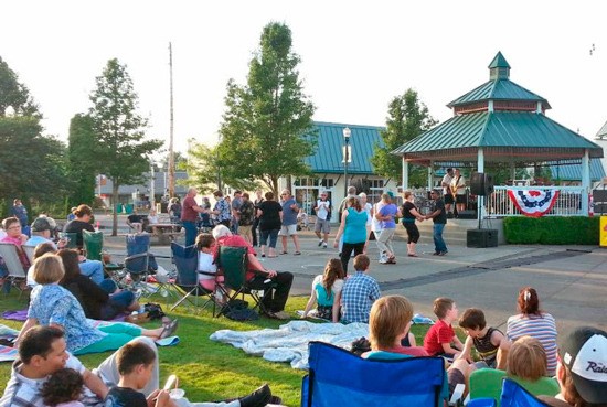 People enjoying Music off Main in Sumner at Heritage Park.