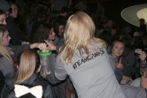 Janet Tracey navigates through the full bleachers