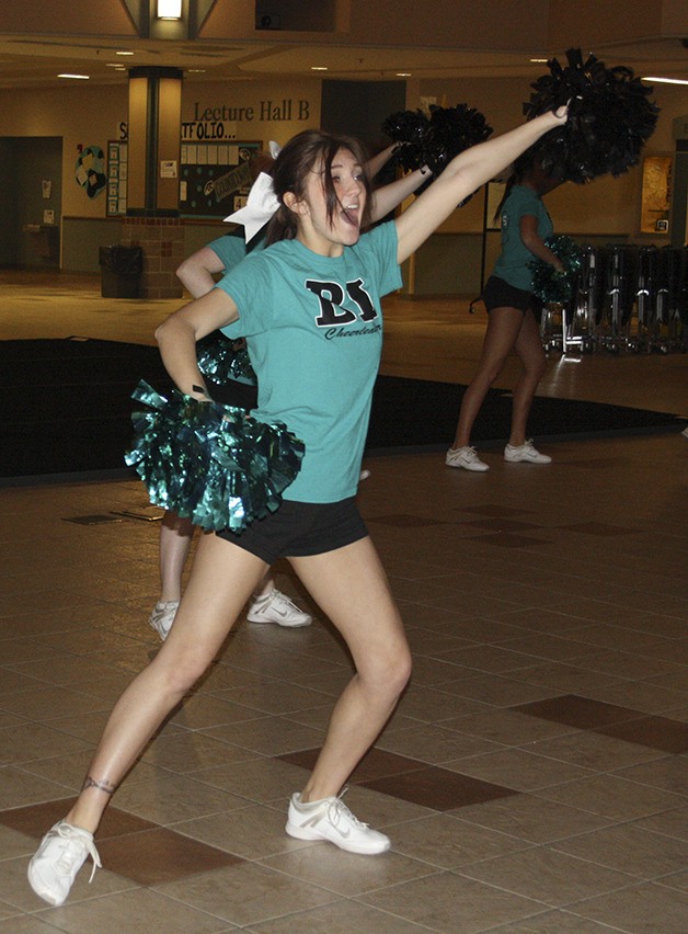 Bonney Lake senior Ailana Bachmann leads the squad in cheers at practice.