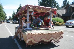 A family rides around the Tapps Island Garage sale on their custom golf cart.