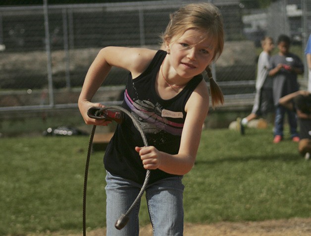 Sophie Ross-Soler works hard Saturday on the way to a second-place finish in the choker setting event for kids in the 7-8 age group.
