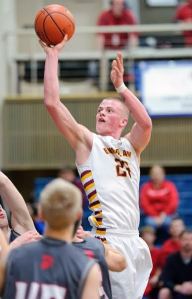 Enumclaw’s Scotty Garvin puts up a shot during the Hornets’ Saturday loss to Stanwood. Photo by Vince Miller.