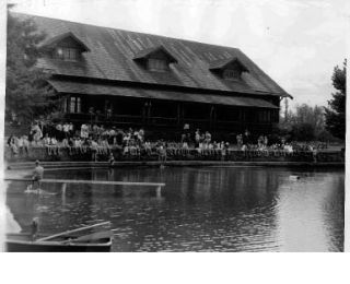 Contestants wait their turn during a swim meet at Pete’s Pool.  Information with this  photograph suggests it was taken in the 1950s. Pete’s Pool was created by resident Pete Chorak and community  members. The  spring-fed pool was a popular summer spot until it was closed and downsized to a wading pool in the late  1980s-early 1990s.  The fieldhouse still stands.