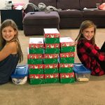 Ellie Schmidt and Amelia Poulin finish up some of the care packages they put together to donate to the Samaritan&rsquo;s Purse program at the Wabash Church. Contributed photo.