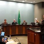 Former councilman Mark Hamilton speaks to the council Nov. 22 about a possible toxicity study being included in the next biennial budget and about the proposed new entrance to Victor Falls Park. Photo by Ray Still.