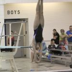 McKenna Webster completes a dive during the district competition at Curtis High School. Photo by Ray Still.