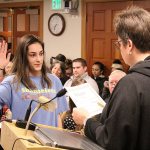 Emma Zahourek being sworn in by Mayor Liz Reynolds. Photo by Ray Still.