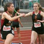 Last year, Hornets Aleea Gwerder took the baton from Josie Neu in the last leg of the 1,600 relay. Enumclaw took the gold at the state event. Both Hornets are now graduated. Photo by Dennis Box