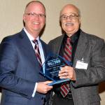 Michael Gordon, right, receiving his award with C. Todd Aherns, treasurer of UsTOO International. Submitted photo.