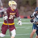 Then-senior Marcuz Henke, a captain of the Hornet Lacrosse team last year, looks to get past a defender during the 19-7 victory over Auburn Riverside. Photo by Vince Miller.