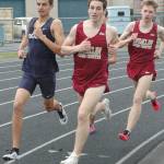 Enumclaw High&rsquo;s Alec Ritter, middle, and Sam Lingwall compete during Thursday&rsquo;s 1,600-meter race at Enumclaw High. The Hornet pair finished second and third, respectively, adding points to the EHS total. Photo by Kevin Hanson.