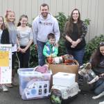 Jeff Boyd, founder of Left Behind K9 Rescue, paid a visit to Wilkeson Elementary School to accept donations. He was joined by students in the Kids For Canines group and fellow LBK9 volunteers. Photo by Kevin Hanson.