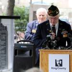 Tom Krueger leads a prayer during last week&rsquo;s ceremony as Al Zarb looks on. Both are members of Enumclaw&rsquo;s VFW Post 1949. Photo courtesy of King County.