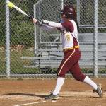 White River senior Alli Brewer has helped the Hornets race to familiar turf, atop the South Puget Sound League 3A standings. Also, she connects for a hit during a recent home game. Photo by Kevin Hanson.