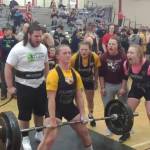 Marissa Bartels competes in the dead list for White River, successful with 305 pounds. Cheerins her on, from left, are teammate Parker Knaus, sister Marina Bartels, assistant coach Dani Barbee and Cheyenne Martin of North Beach High. Photo by Darren Bartels