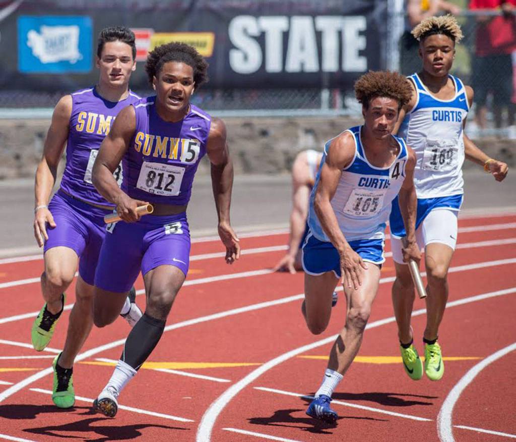 Michael Russell was a part of the boys&rsquo; 4x100 relay. The team placed second in the state competition. Photo by Vince Miller.